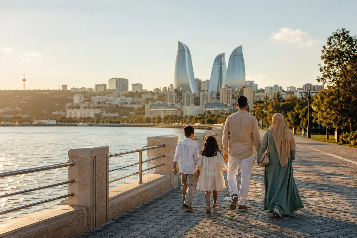 Family walking along the Baku waterfront with the Flame Towers in Azerbaijan