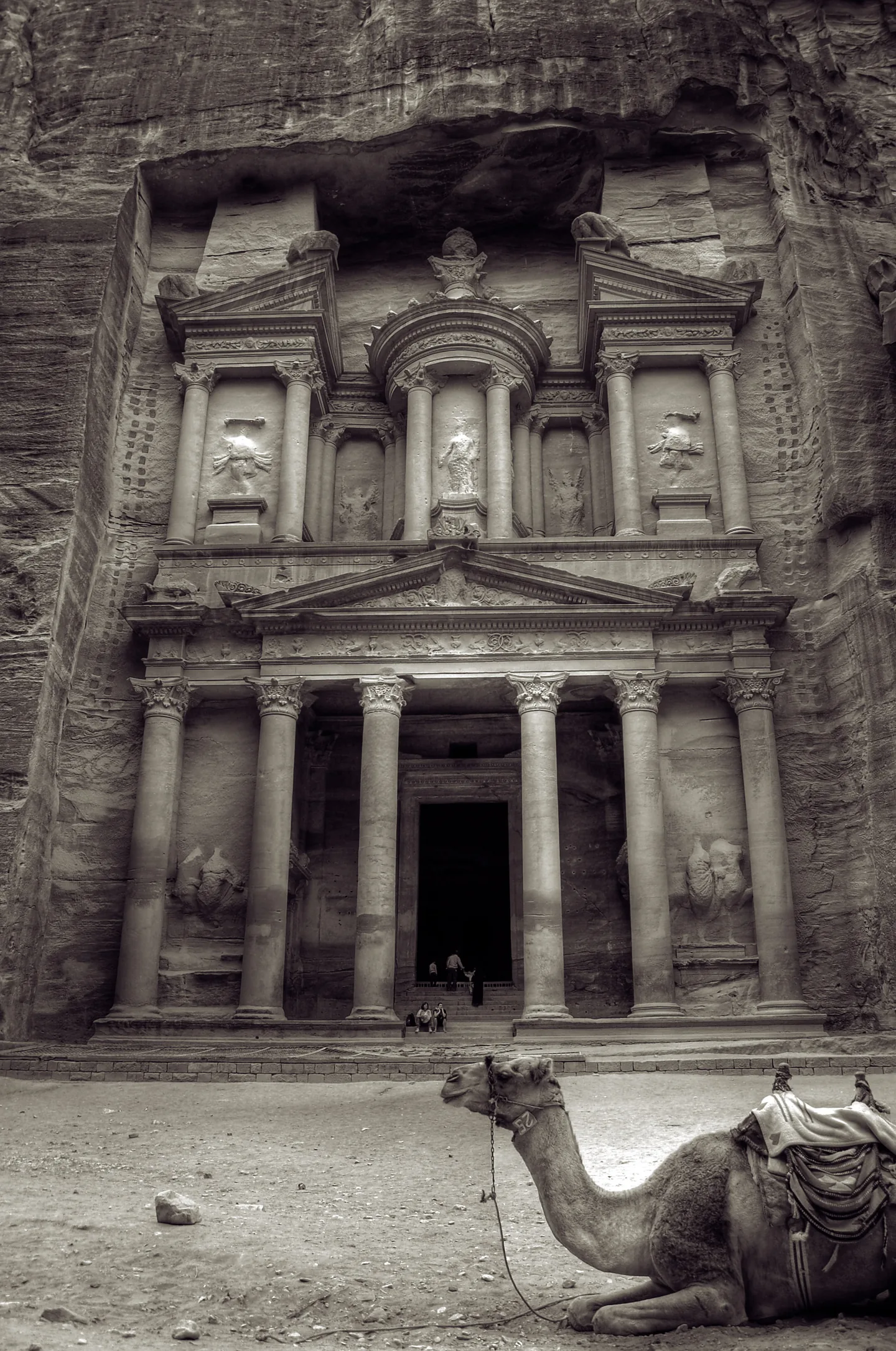 The Treasury carved into sandstone cliffs at Petra, Jordan
