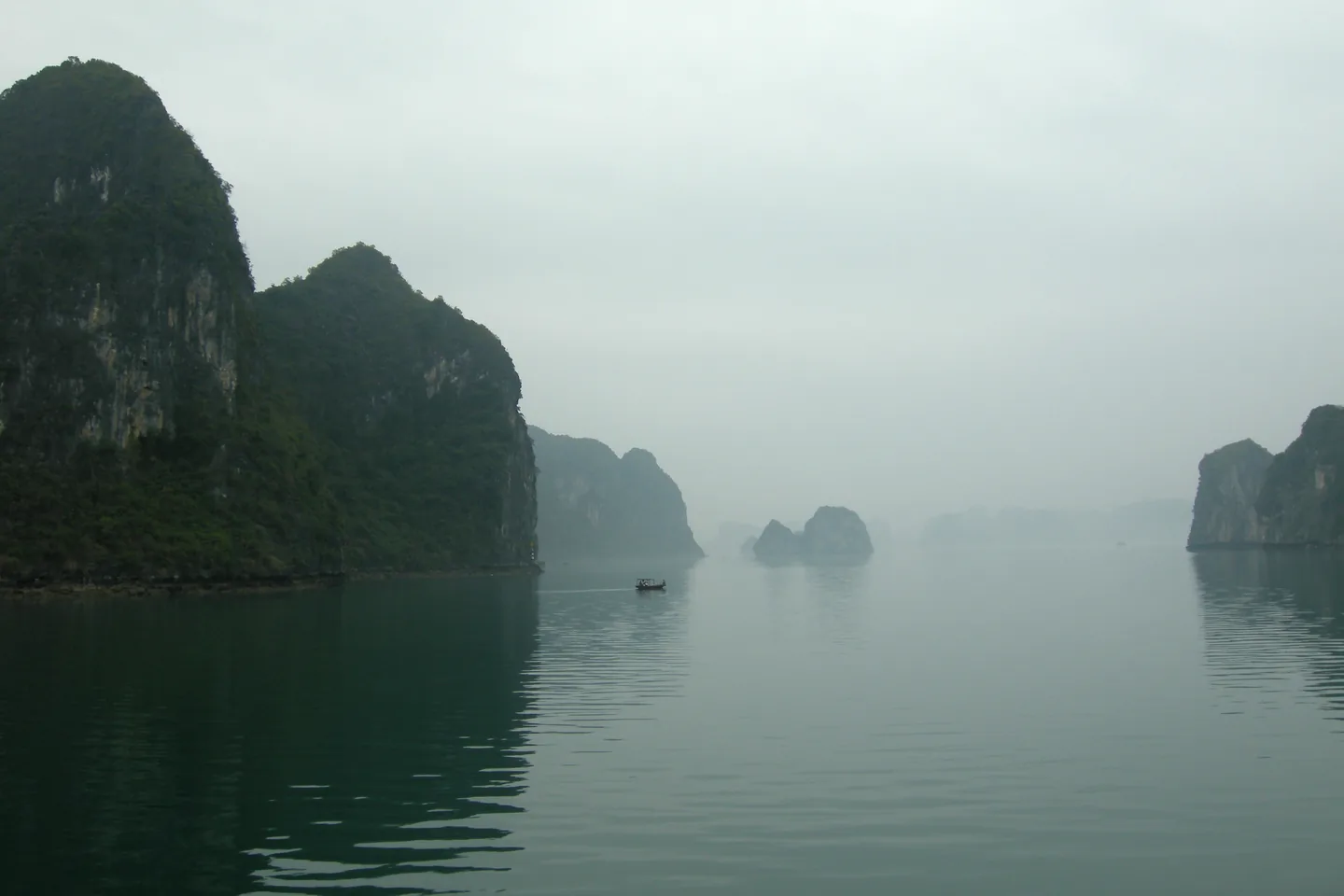 Limestone islands rising from the water in Ha Long Bay, Vietnam